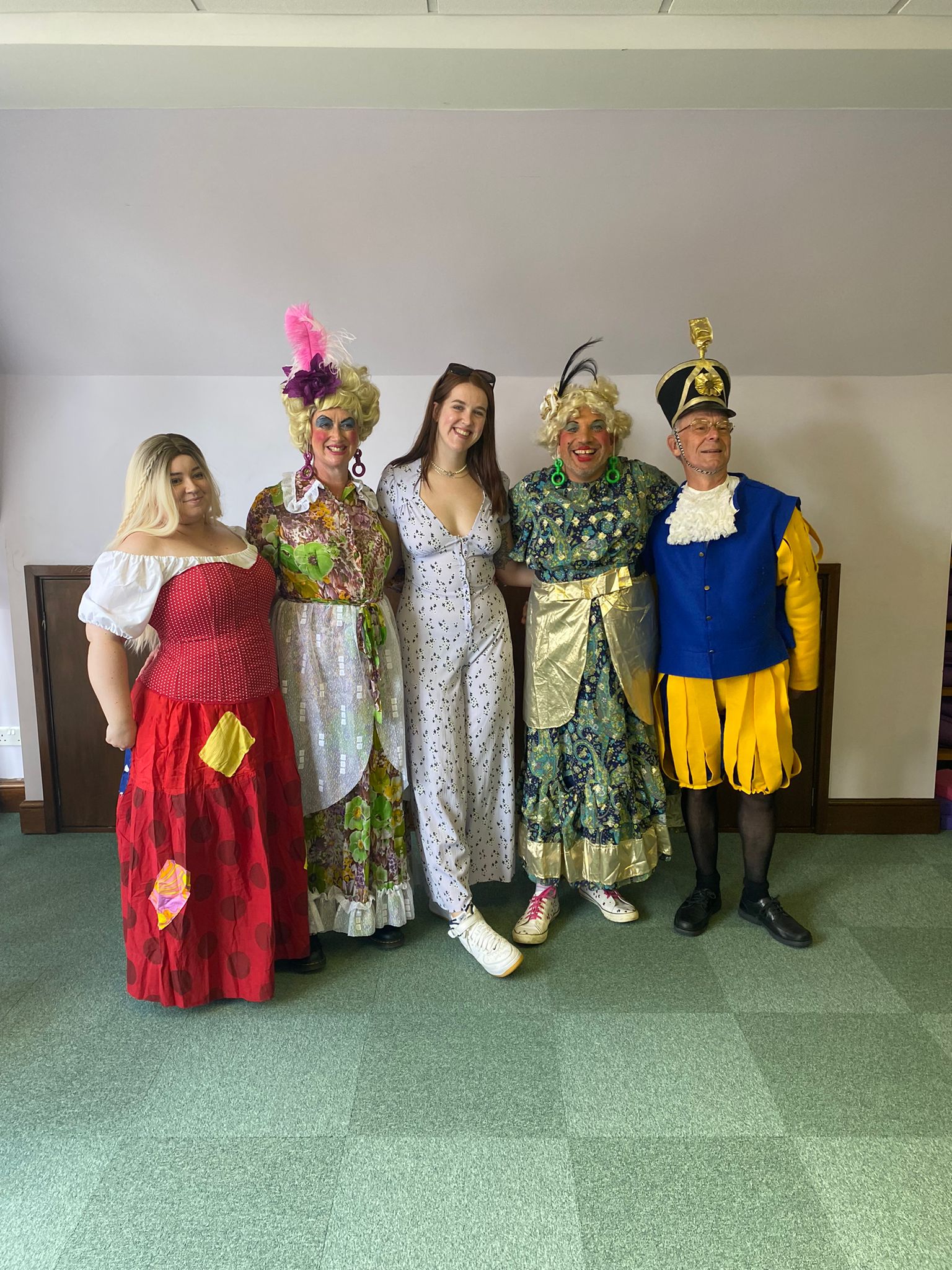 A group photo of some of the cast. Left to right, Cinderella, an Ugly Sister, Our Director, an Ugly Sister and Baron Hardup